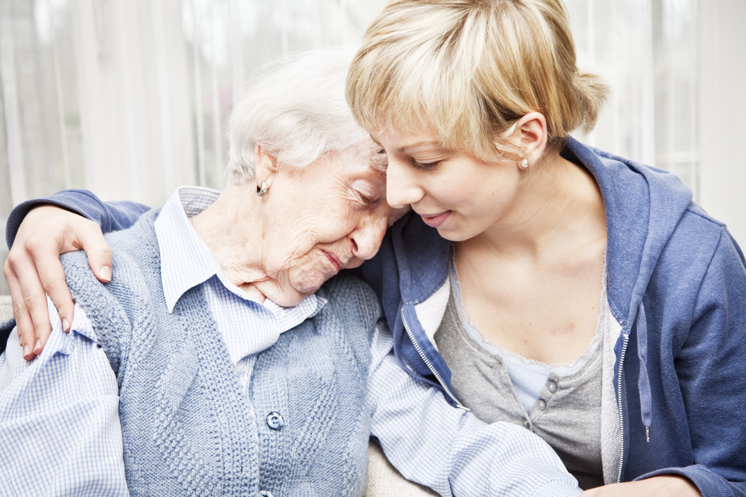 websitepic7 home caregiver consoling sad senior woman
