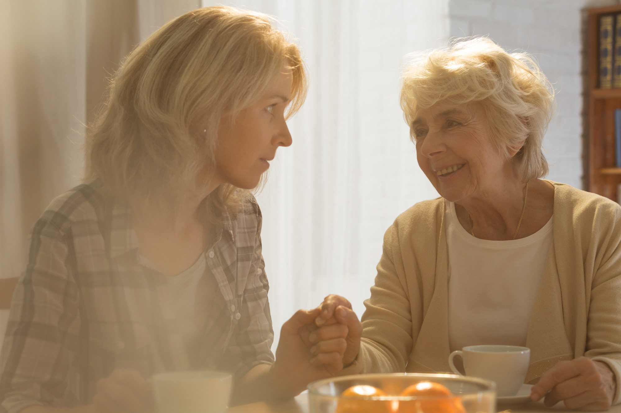 woman-taking-care-of-mother-PU72CQX woman-taking-care-of-mother-PU72CQX